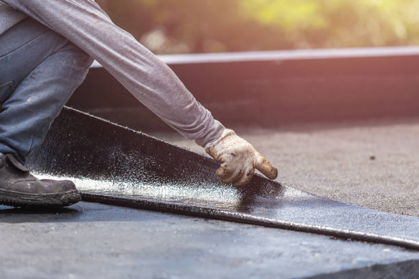 Professional Basement Waterproofing technician working in Penfield, NY